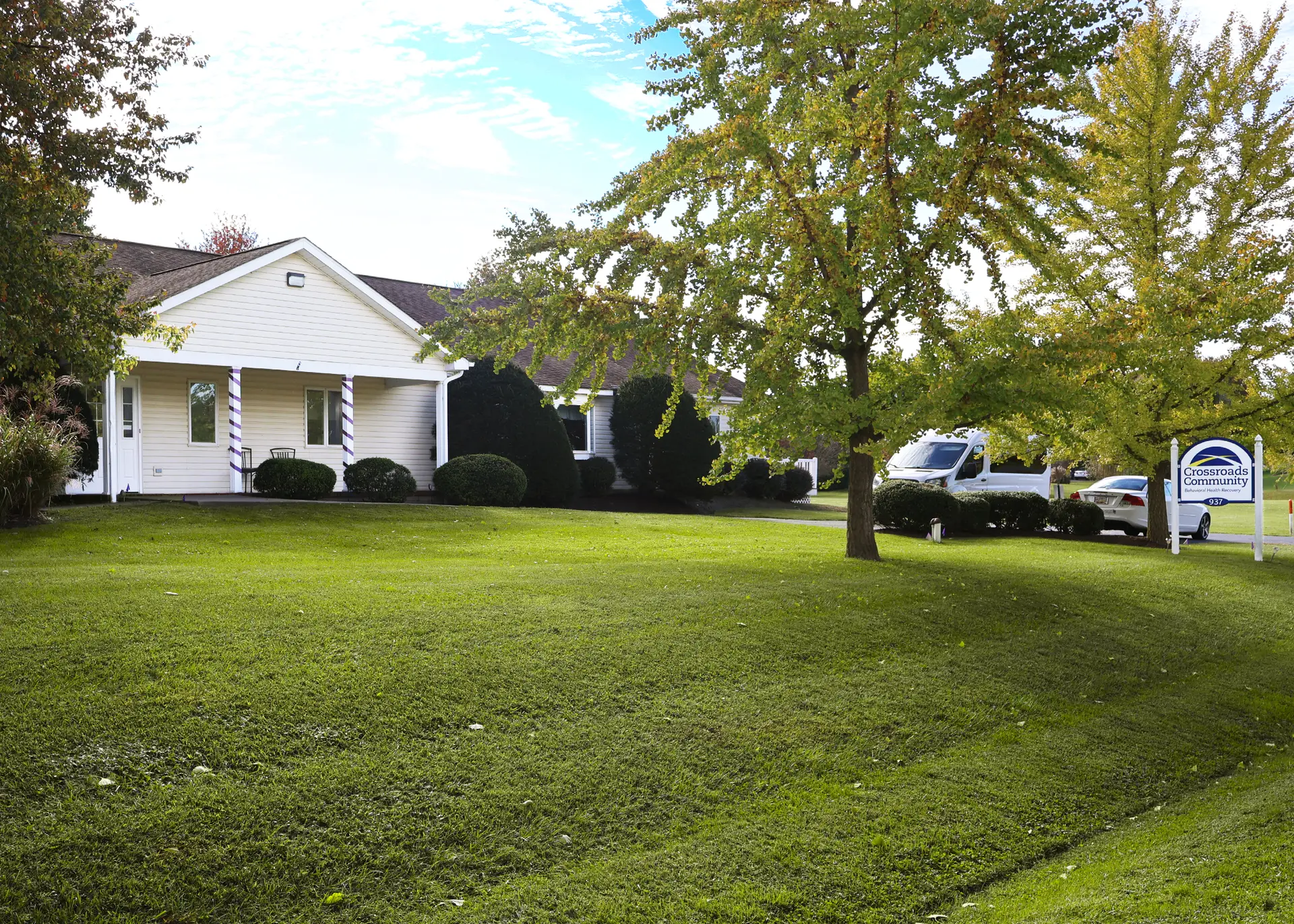 Rivers Crossing Wellness Community office building in Chestertown, Maryland surrounded by trees and a green lawn.