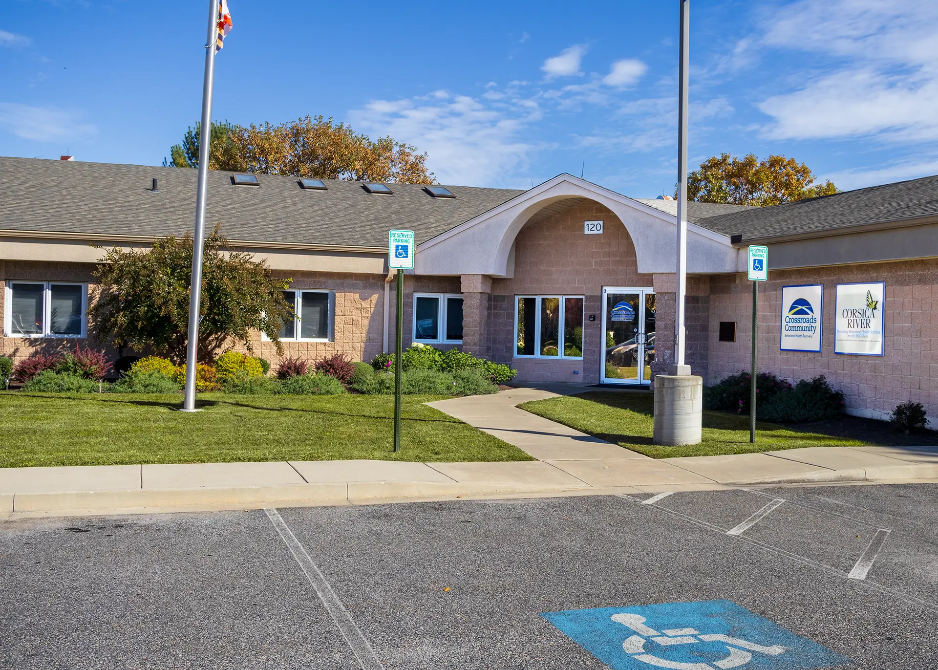 Exterior of Rivers Crossing Wellness Community office in Centreville, Maryland with accessible parking and landscaped entrance.