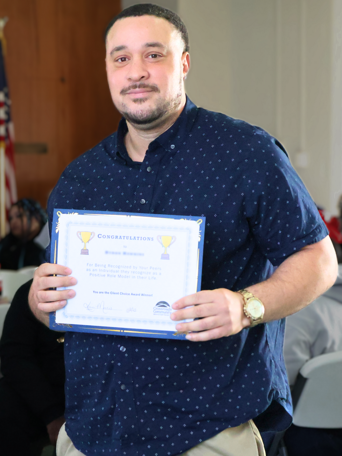 Man holding a certificate of recognition at a Crossroads Community and Corsica River mental health event