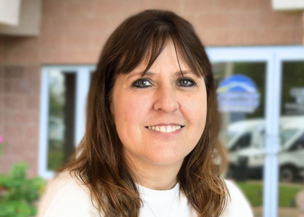 Melanie Rodriguez, Program Support Coordinator at Crossroads Community, providing essential support for behavioral health programs